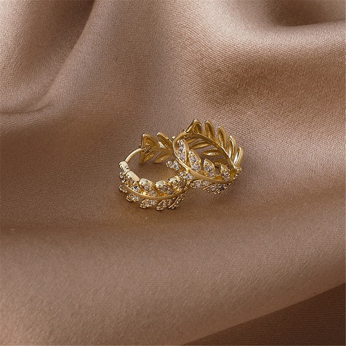 Cubic Zirconia and 18K Gold-Plated Leaf Huggie Earrings, gold huggie earrings, botanical inspired, front view