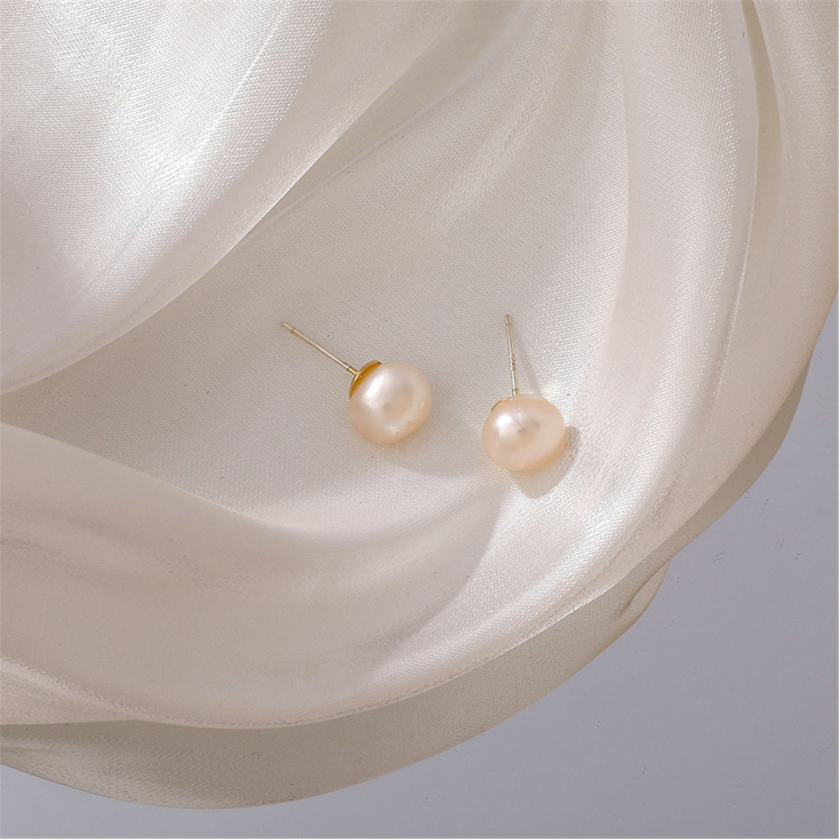 Pearl and 18K Gold-Plated Stud Earrings, gold stud earrings for women, vintage-inspired design, side view