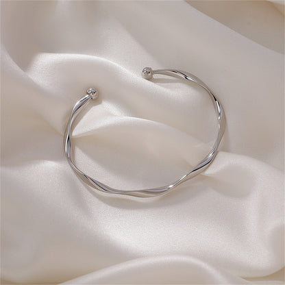 Silver-Plated Curved Waves Cuff, silver bracelet for women, vintage-inspired design, front view