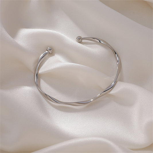 Silver-Plated Curved Waves Cuff, silver bracelet for women, vintage-inspired design, front view