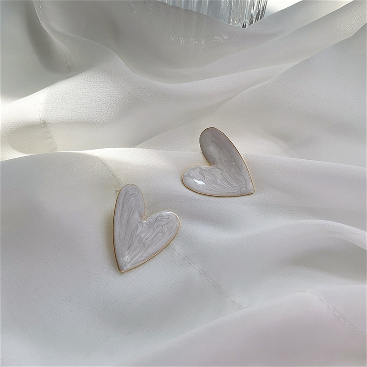 Enamel and 18K Gold-Plated Heart Stud Earrings, gold stud earrings for women, dainty minimalist design, side view