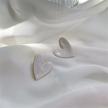 Enamel and 18K Gold-Plated Heart Stud Earrings, gold stud earrings for women, dainty minimalist design, side view