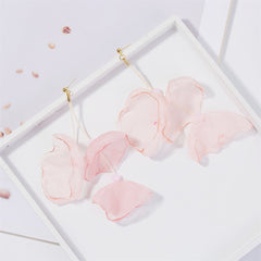 Chic pink silk earrings with a three-petal drop design, complemented by 18K gold-plated hooks for an elegant finish.