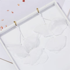 Stunning white flower earrings featuring gold hooks, combining comfort and elegance for versatile styling on any occasion.