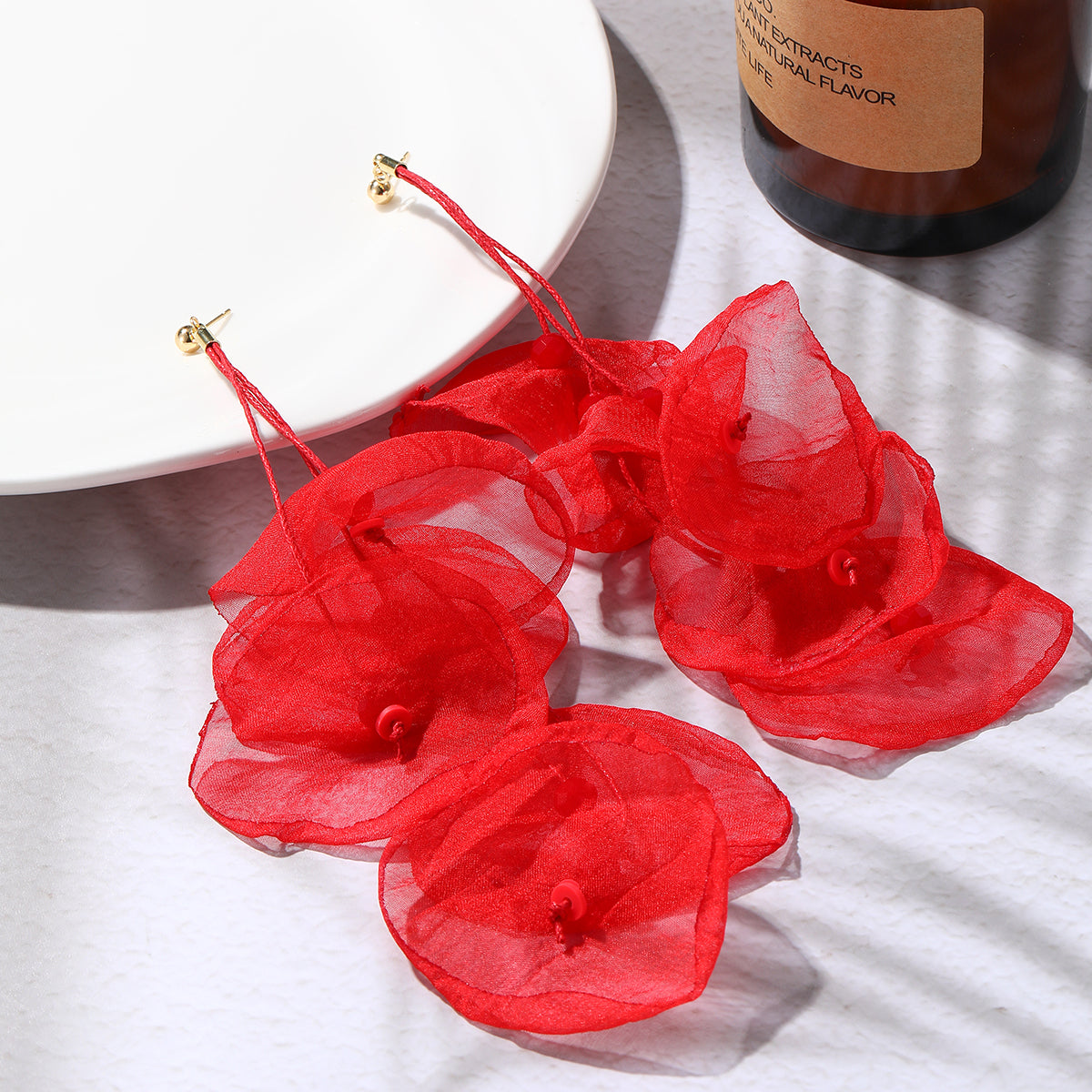 Beautiful red flower earrings with gold-plated hooks, ideal for adding a touch of elegance and color to your ensemble.