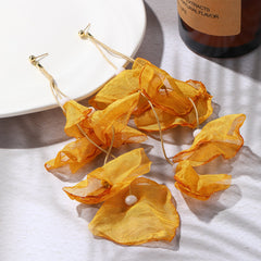 Stunning yellow polyester earrings shaped like flowers, adorned with gold-plated hooks for a chic and sophisticated look.