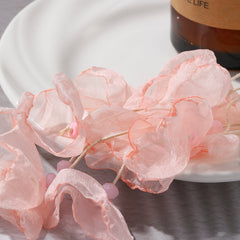 Beautiful pink polyester earrings shaped like flowers, adorned with gold-plated hooks for a sophisticated touch.