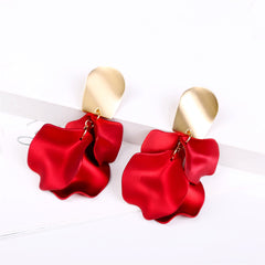 Elegant red flower earrings made of acrylic, featuring gold-plated accents in a four-petal drop design.