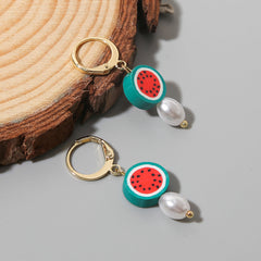 Delightful watermelon huggie earrings featuring pearl and polymer clay, elegantly finished with 18K gold plating for sophistication.