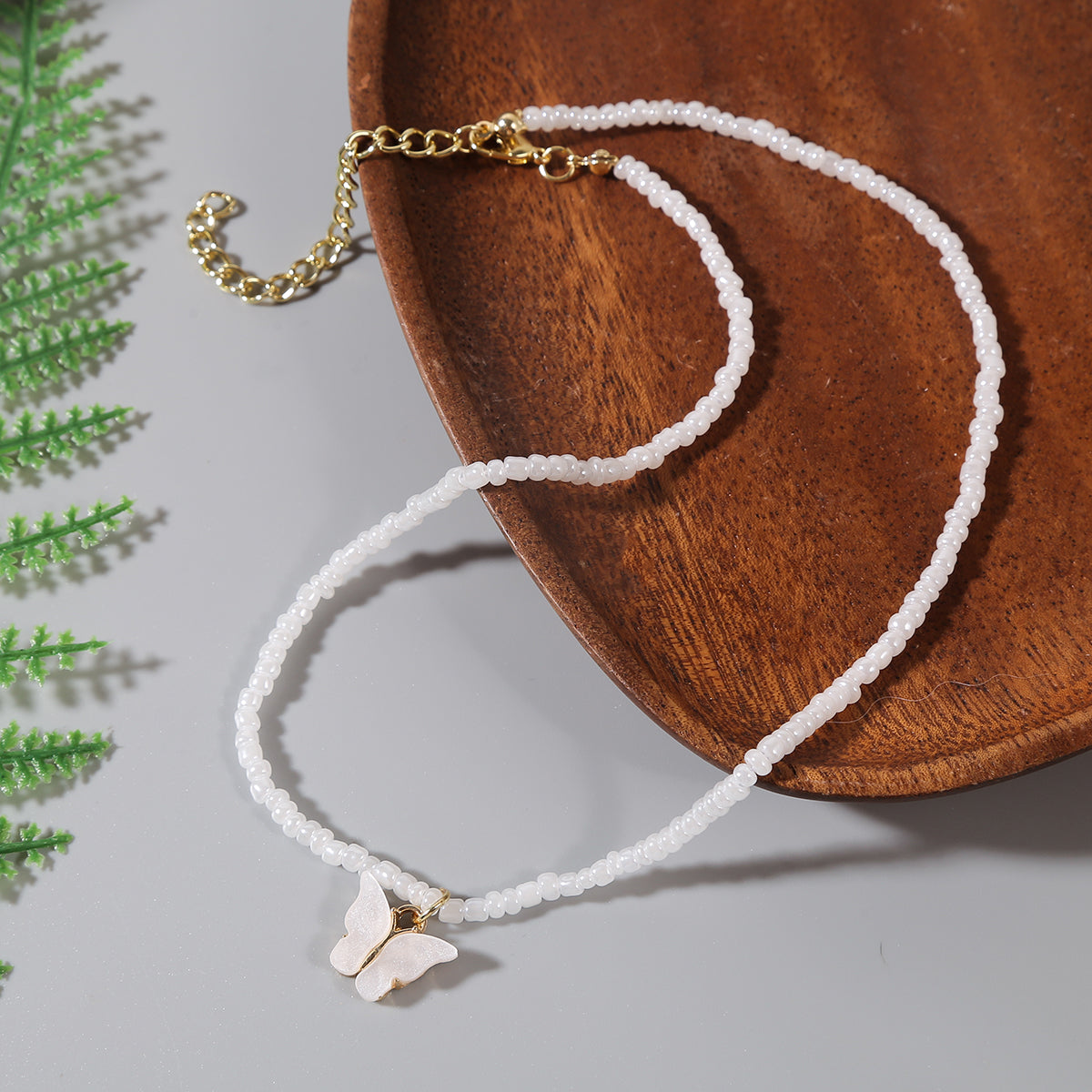 White and Howlite Butterfly Beaded Pendant Necklace, pendant necklace for women, dainty minimalist design, detail close-up