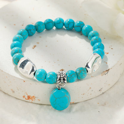 Turquoise and Silver-Plated Oval Charm Stretch Bracelet, silver bracelet for women, vintage-inspired design, detail close-up