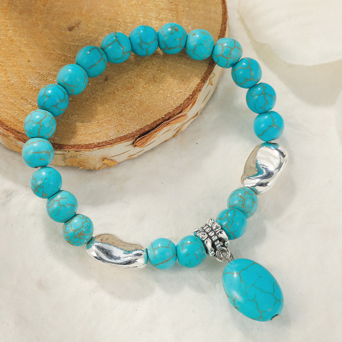 Turquoise and Silver-Plated Oval Charm Stretch Bracelet, silver bracelet for women, vintage-inspired design, side view
