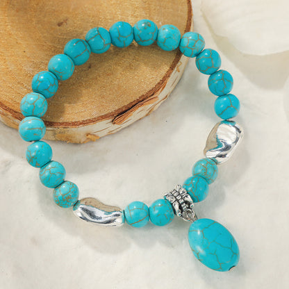 Turquoise and Silver-Plated Oval Charm Stretch Bracelet, silver bracelet for women, vintage-inspired design, side view