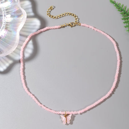 Pink Howlite and Acrylic 18K Gold-Plated Butterfly Pendant Necklace, gold pendant necklace for women, detail close-up