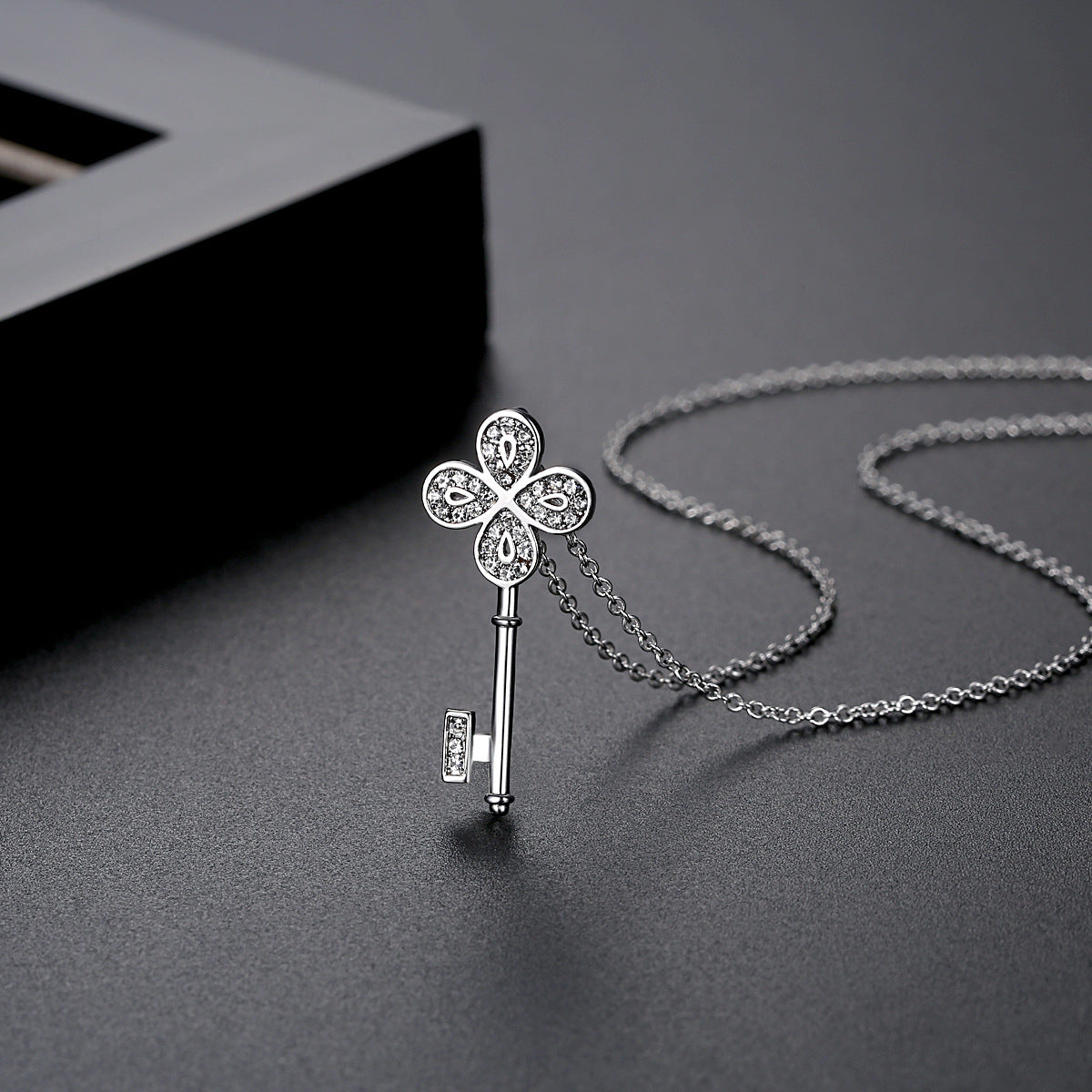 Cubic Zirconia and Silver-Plated Key Pendant Necklace, silver pendant necklace for women, everyday style, side view
