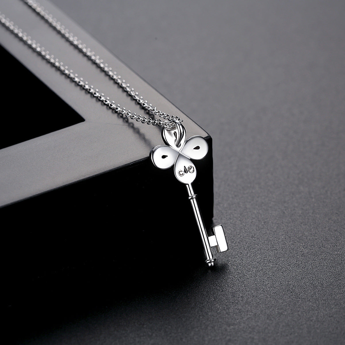 Cubic Zirconia and Silver-Plated Key Pendant Necklace, silver pendant necklace for women, everyday style, detail close-up
