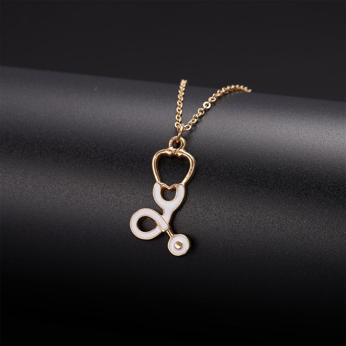 Enamel and 18K Gold-Plated Stethoscope Pendant Necklace, gold pendant necklace for women, dainty minimalist design, side view