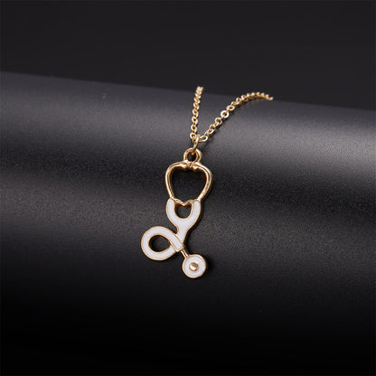 Enamel and 18K Gold-Plated Stethoscope Pendant Necklace, gold pendant necklace for women, dainty minimalist design, side view