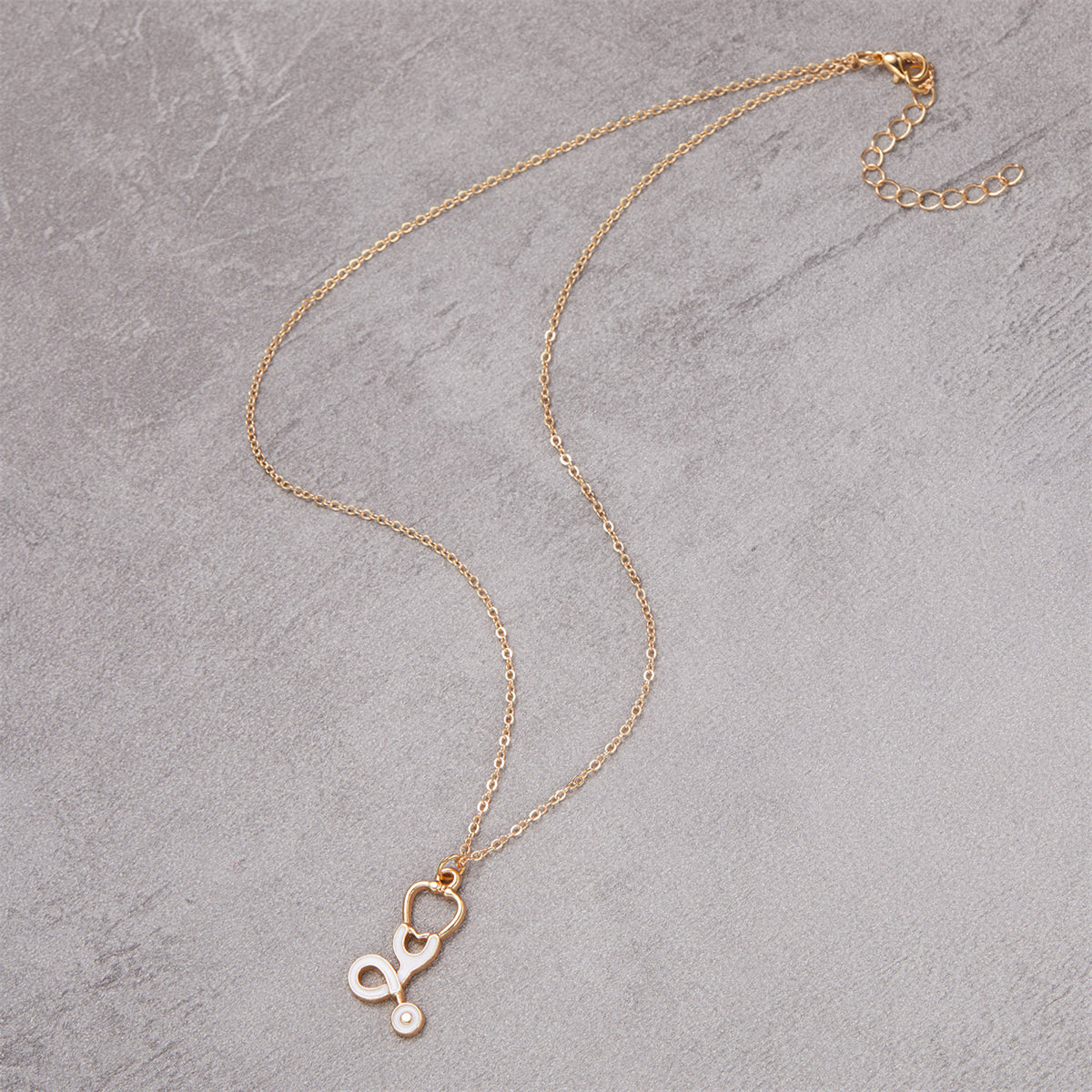 Enamel and 18K Gold-Plated Stethoscope Pendant Necklace, gold pendant necklace for women, detail close-up