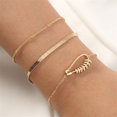 Three elegant 18K gold-plated bracelets featuring a chain and a charming leaf design, perfect for any occasion.
