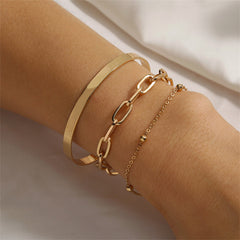 Two elegant gold chains and a stylish bracelet displayed on a white surface, showcasing the 18K gold-plated design.