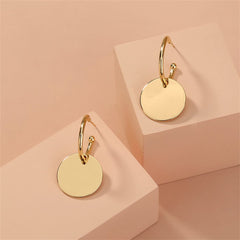 Stunning 18K gold-plated huggie earrings with a circular design and a delicate small disc, perfect for any occasion.
