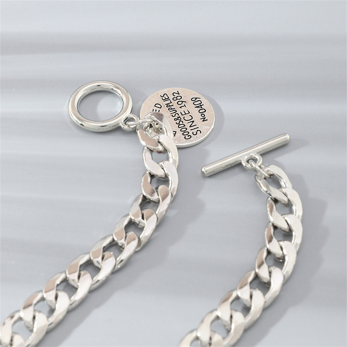 Silver-Plated 'Goods and Supplies' Curb Chain Toggle Bracelet, silver bracelet for women, detail close-up
