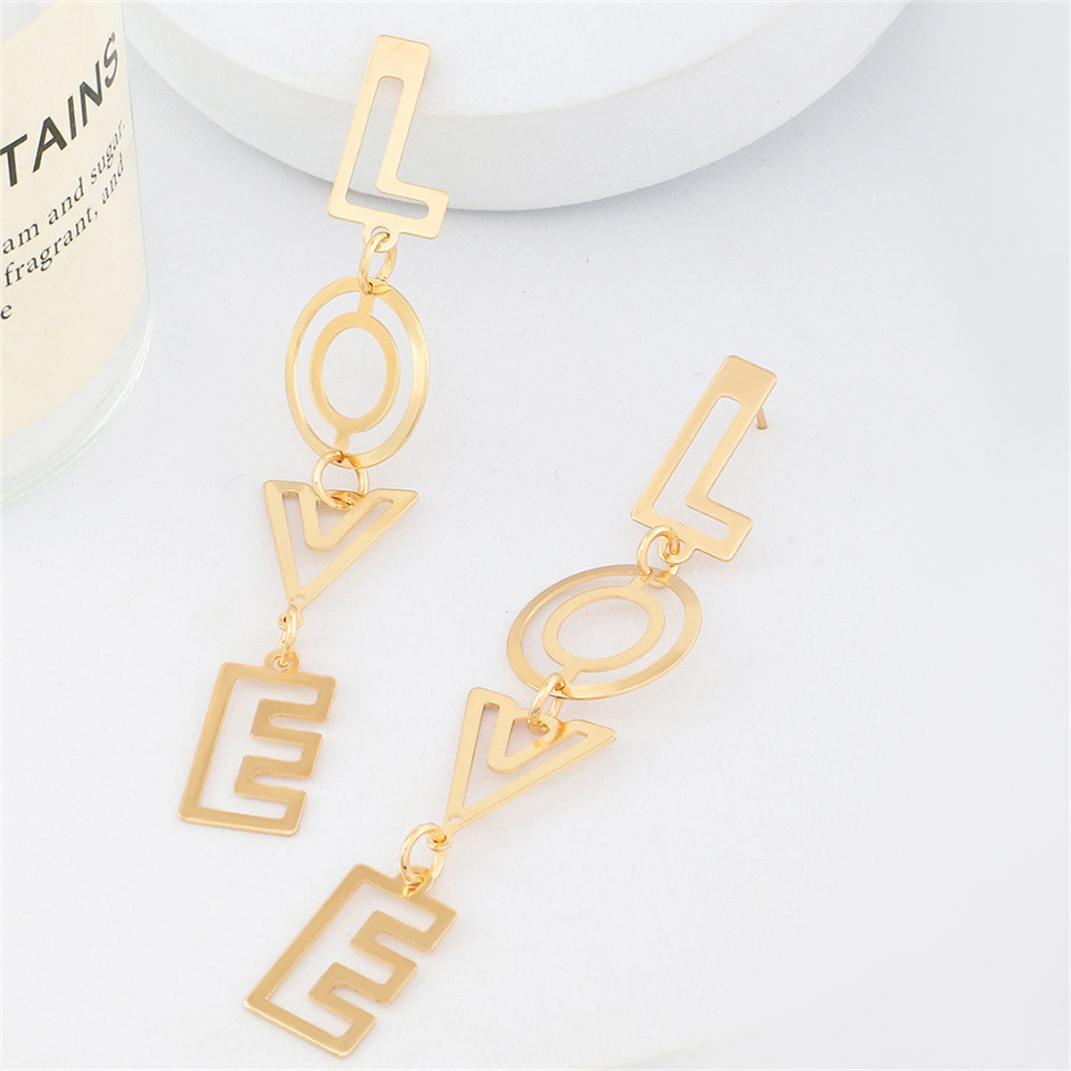 Beautifully crafted 18K gold-plated 'Love' earrings with an intricate openwork style, a perfect gift for someone special.