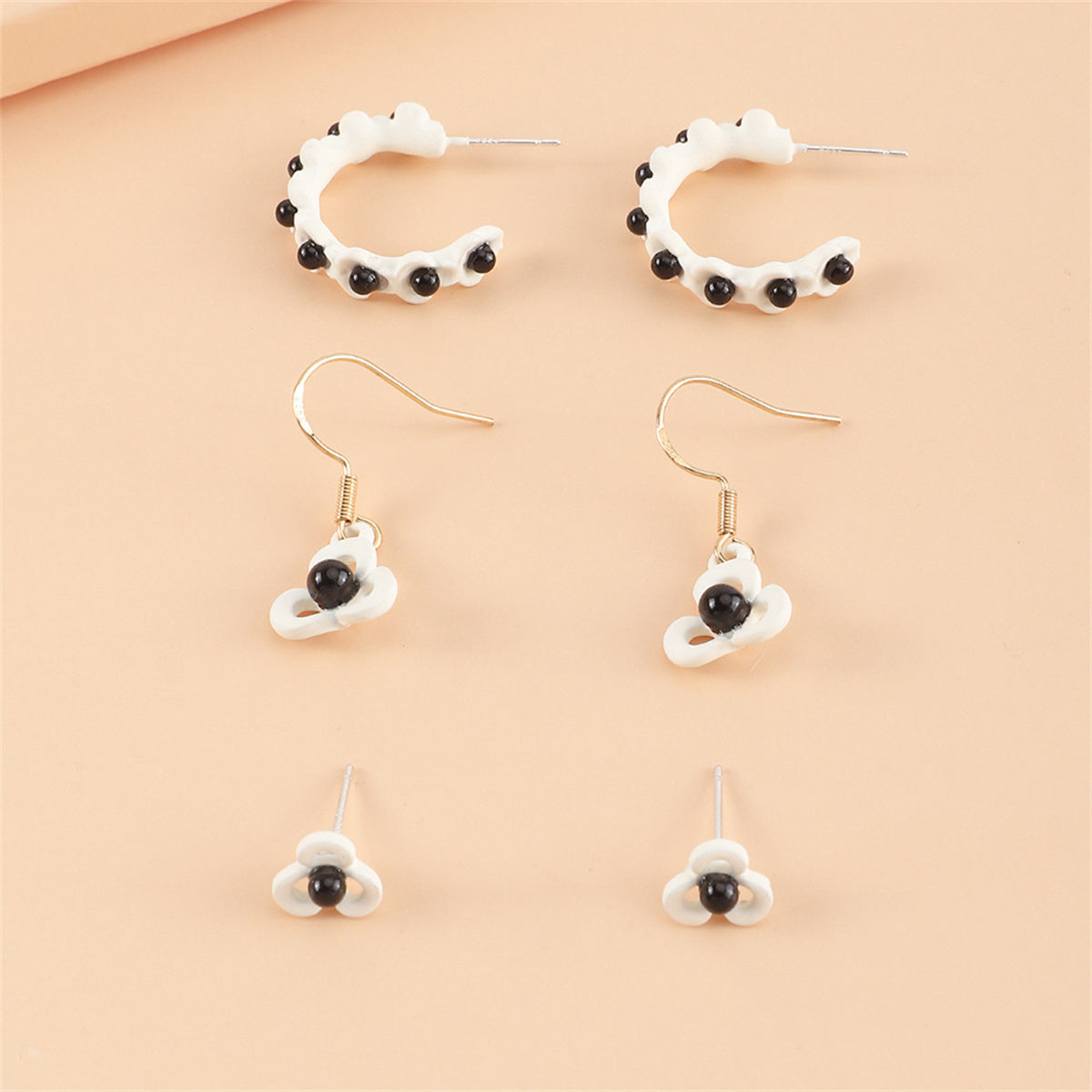 Black and White Floral Openwork Earring Set, huggie earrings, dainty minimalist design, detail close-up