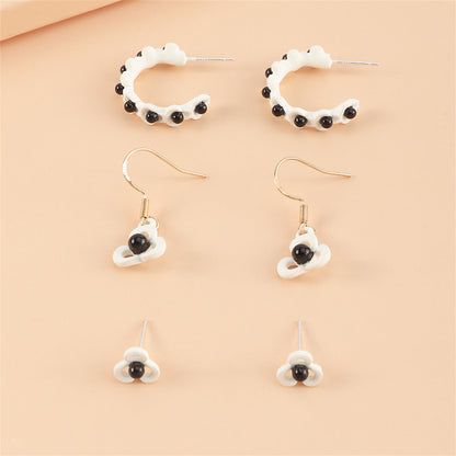 Black and White Floral Openwork Earring Set, huggie earrings, dainty minimalist design, detail close-up