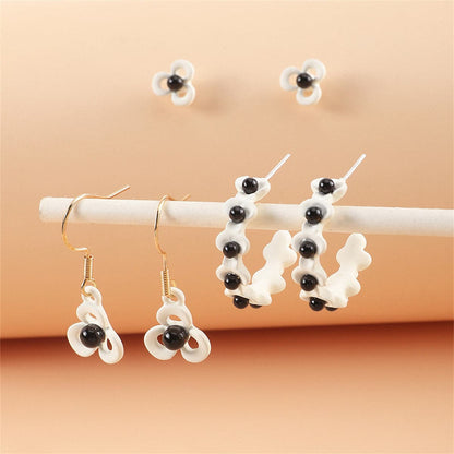 Black and White Floral Openwork Earring Set, huggie earrings, dainty minimalist design, side view