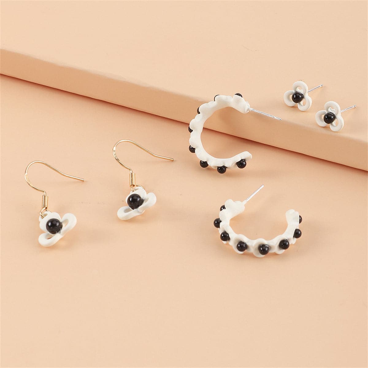 Black and White Floral Openwork Earring Set, huggie earrings, dainty minimalist design, front view