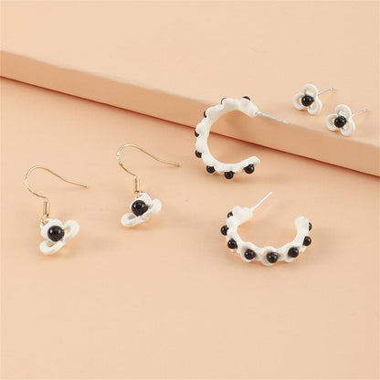 Black and White Floral Openwork Earring Set, huggie earrings, dainty minimalist design, front view