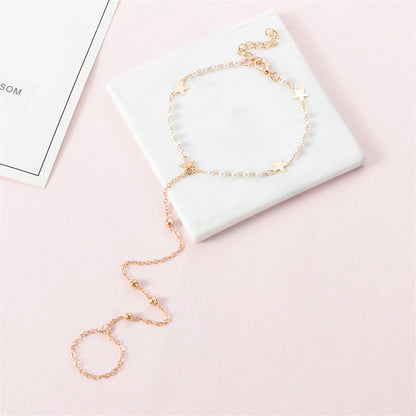 Pearl and 18K Gold-Plated Star Ankle-To-Toe Ring Anklet, gold statement rings for women, botanical inspired, detail close-up