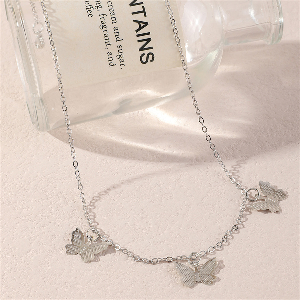Silver-Plated Butterfly Station Necklace, silver pendant necklace for women, dainty minimalist design, front view