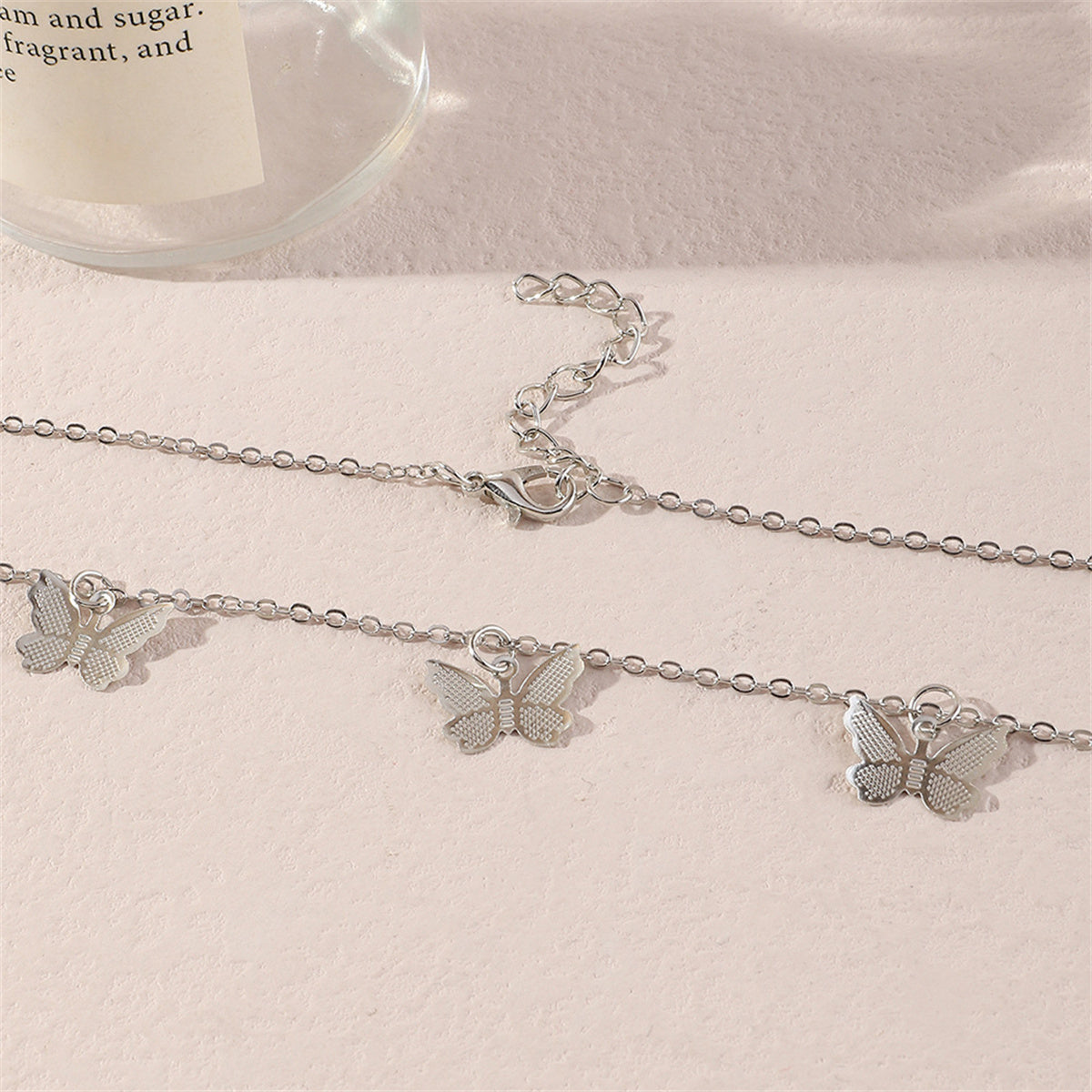 Silver-Plated Butterfly Station Necklace, silver pendant necklace for women, dainty minimalist design, detail close-up