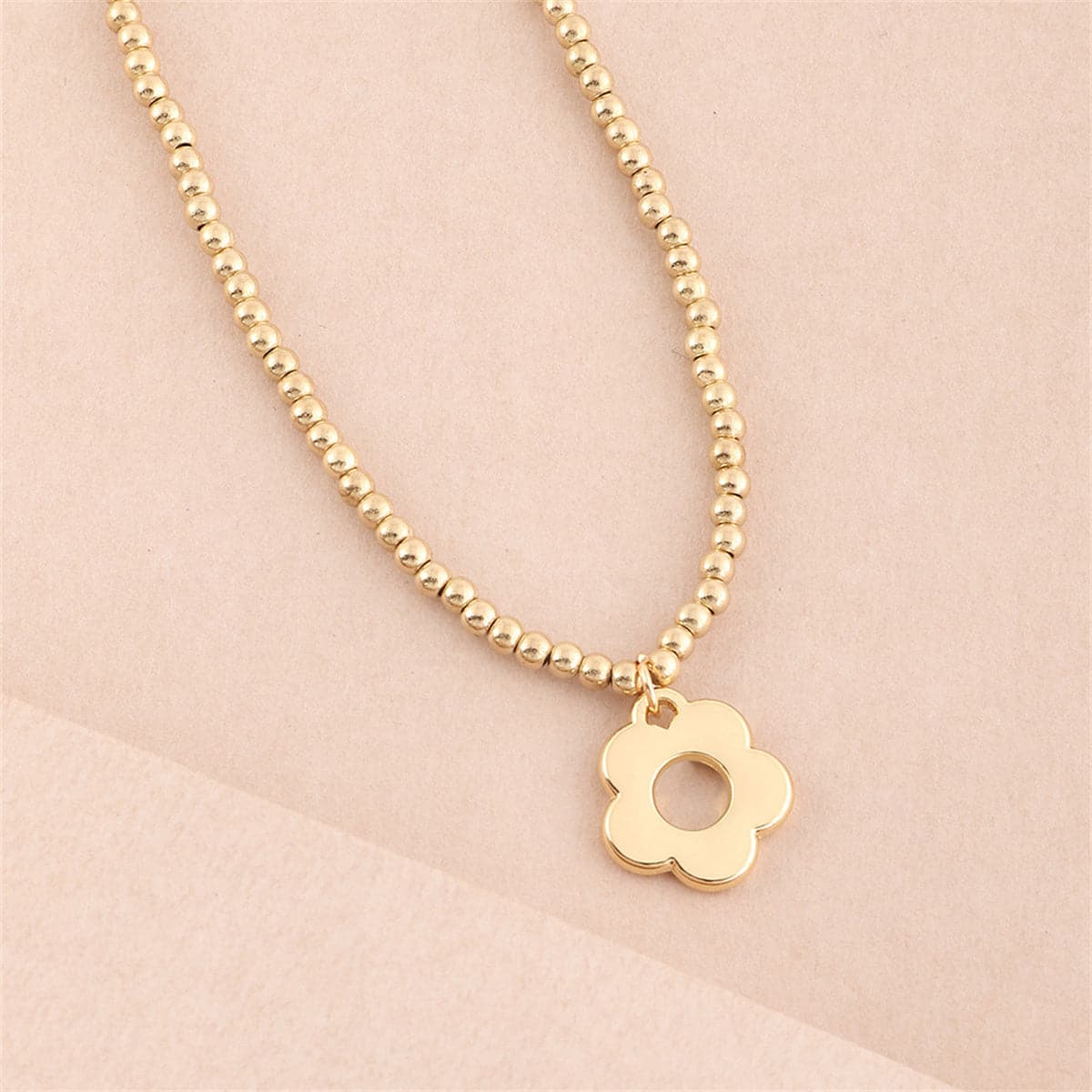 Stunning 18K gold-plated beaded necklace adorned with a charming star pendant, ideal for a stylish accessory.
