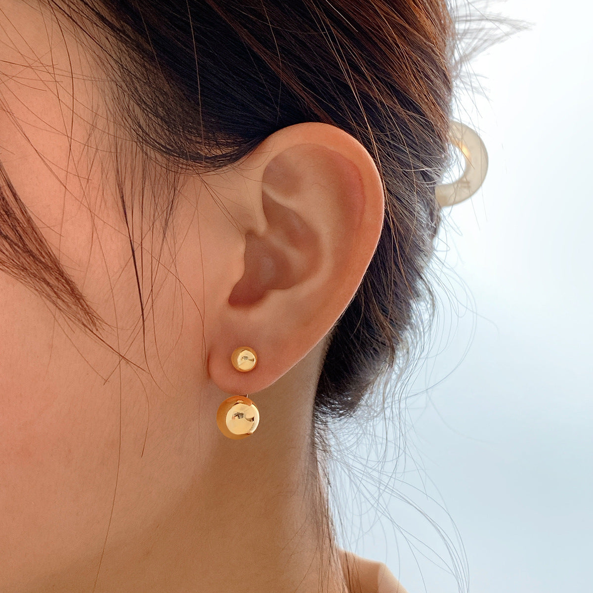 Chic 18K gold-plated ball ear jackets showcasing two beautiful balls, ideal for elevating your jewelry collection.