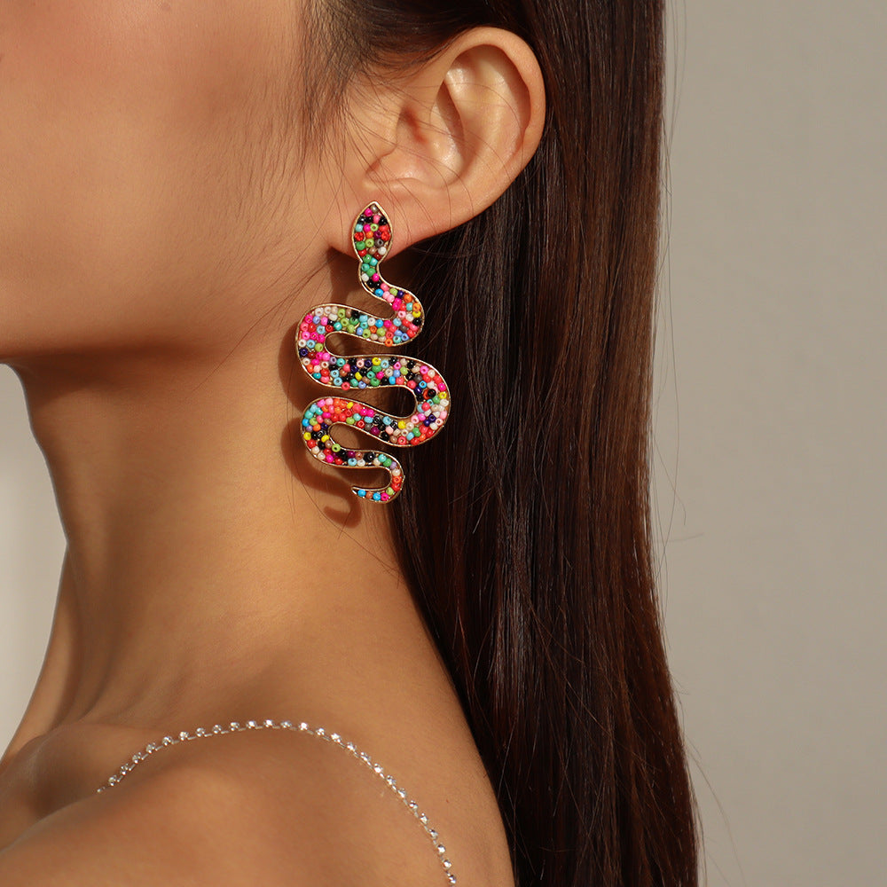 Colored Howlite and 18K Gold-Plated Snake Dangle Earrings, gold drop earrings for women, everyday style, detail close-up