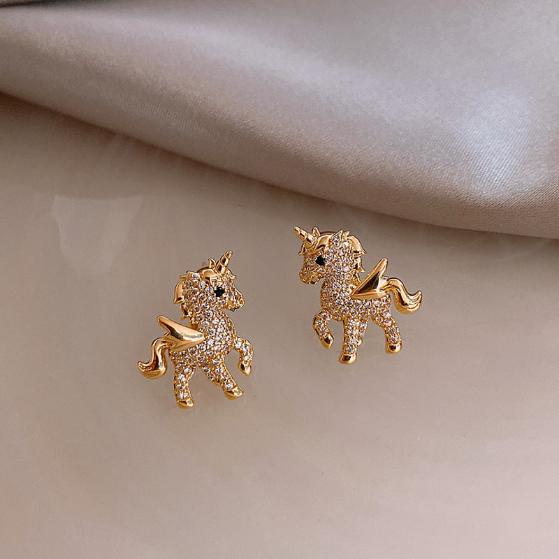 Cubic Zirconia and 18K Gold-Plated Unicorn Stud Earrings, gold stud earrings for women, botanical inspired, detail close-up