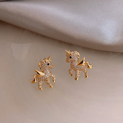 Cubic Zirconia and 18K Gold-Plated Unicorn Stud Earrings, gold stud earrings for women, botanical inspired, detail close-up