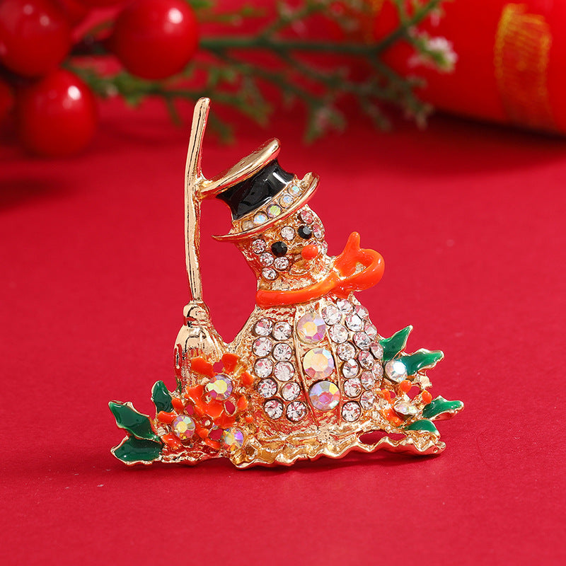 Orange Enamel and Cubic Zirconia Broom Snowman Brooch, brooch pin, vintage-inspired design, front view