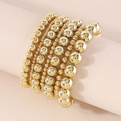 Chic 18K gold-plated beaded bracelets that stretch for comfort, enhancing your look with a touch of elegance.