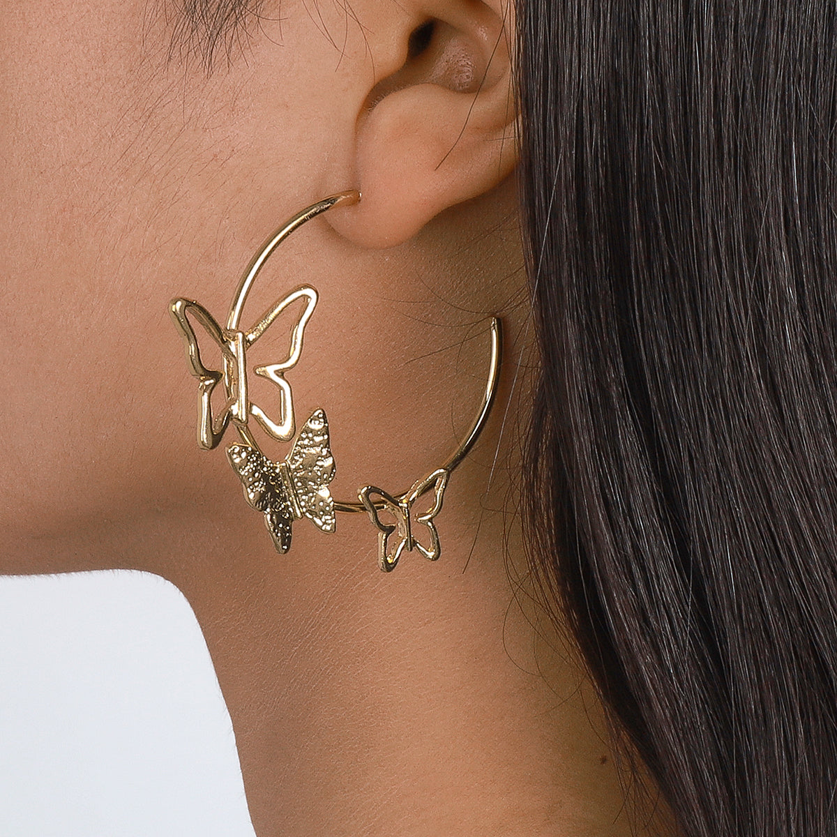 Elegant 18K gold-plated butterfly hoop earrings, perfect for adding a touch of charm to any outfit.