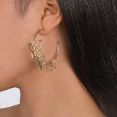 Stunning gold tone butterfly hoop earrings, crafted in 18K gold plating for a luxurious and stylish look.