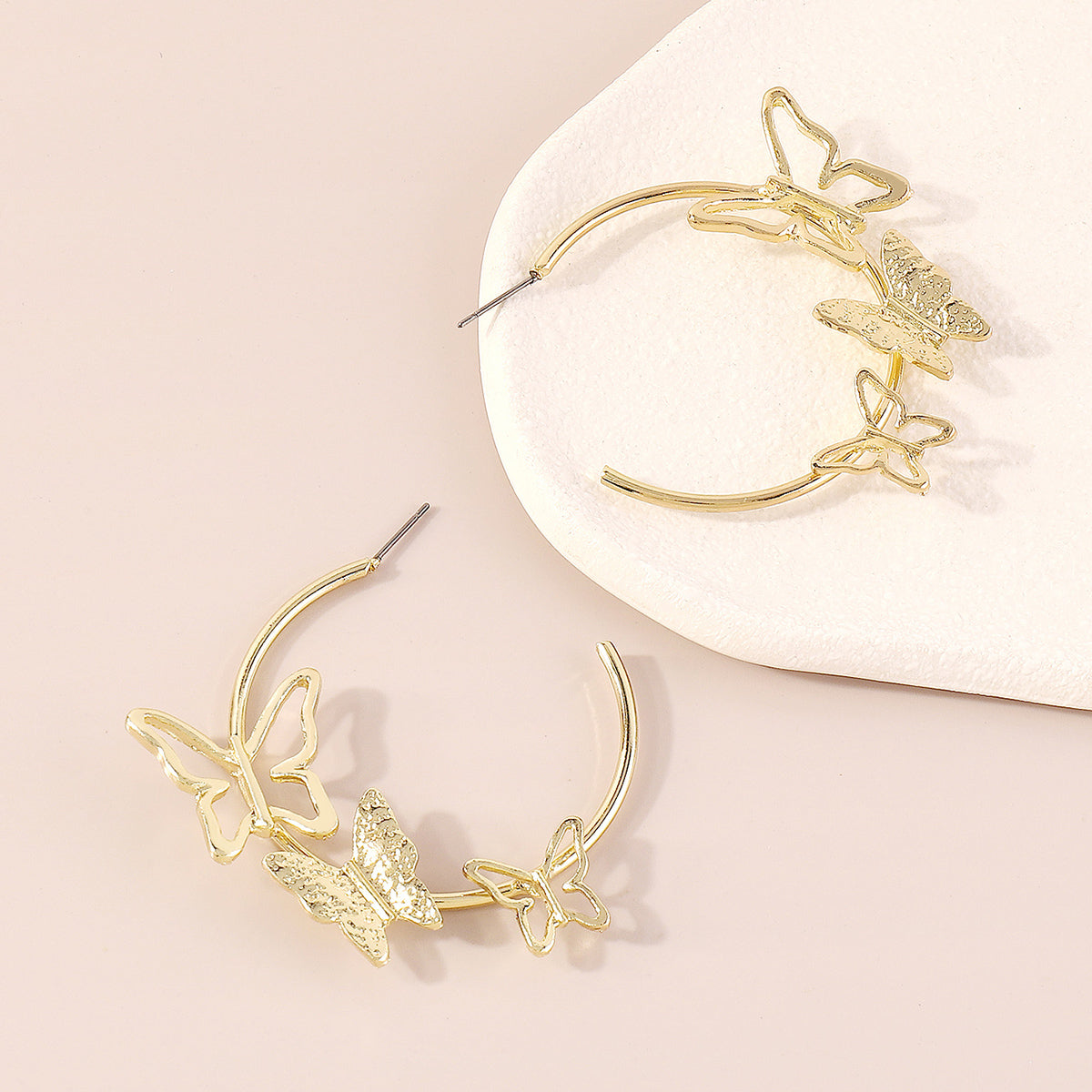 Dazzling 18K gold-plated butterfly hoop earrings, a must-have for those who love unique and elegant jewelry pieces.