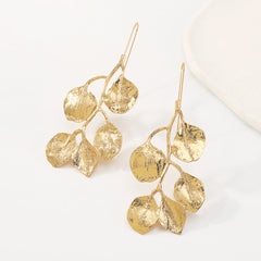 Beautifully crafted 18K gold-plated earrings showcasing leaf details, a perfect accessory for nature lovers and fashion enthusiasts.