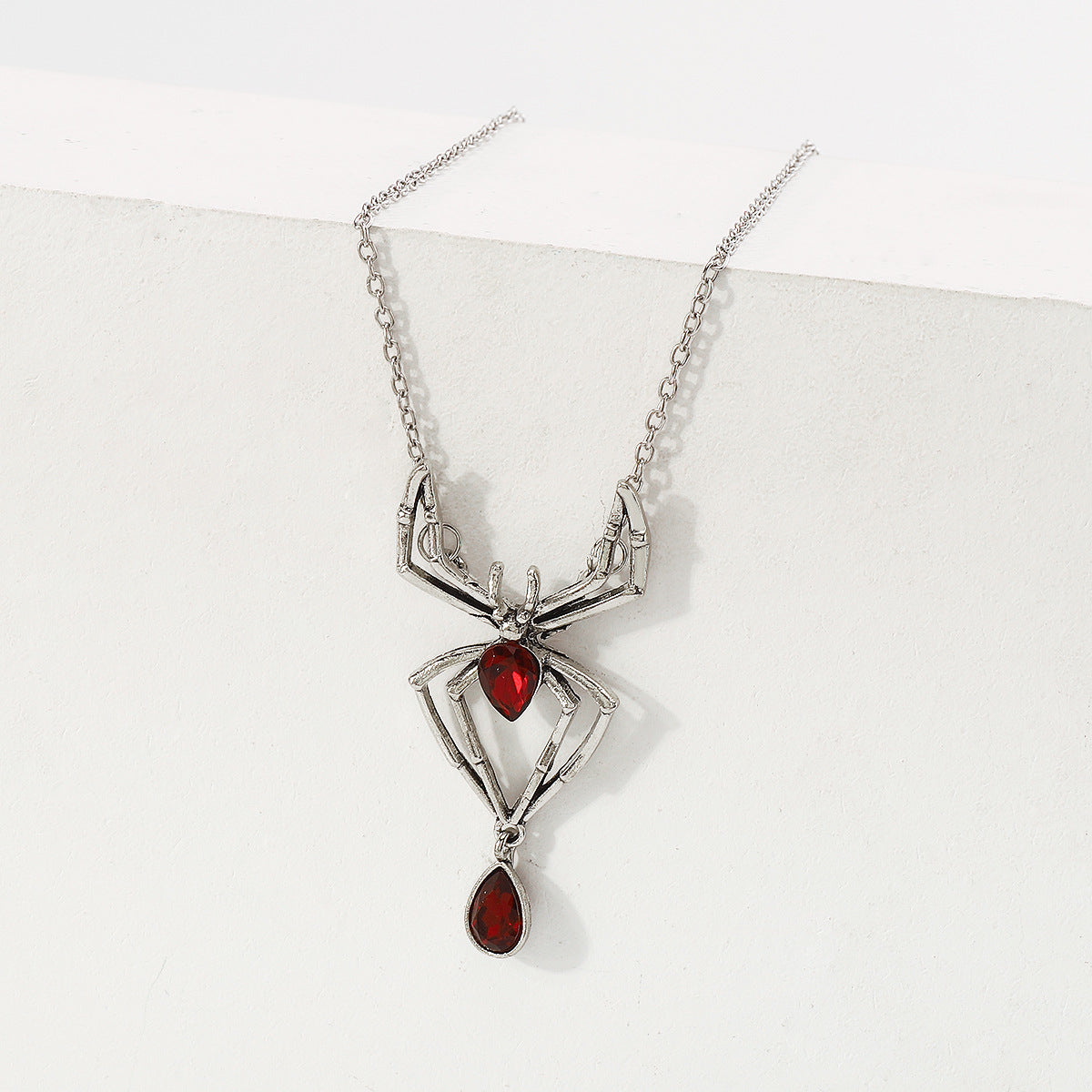 Red Crystal and Silver-Plated Spider Pendant Necklace, silver pendant necklace for women, everyday style, detail close-up