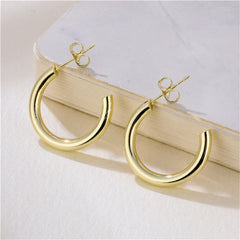 Beautiful 18K gold-plated C-shape huggie earrings, perfect for adding a touch of elegance to any outfit.