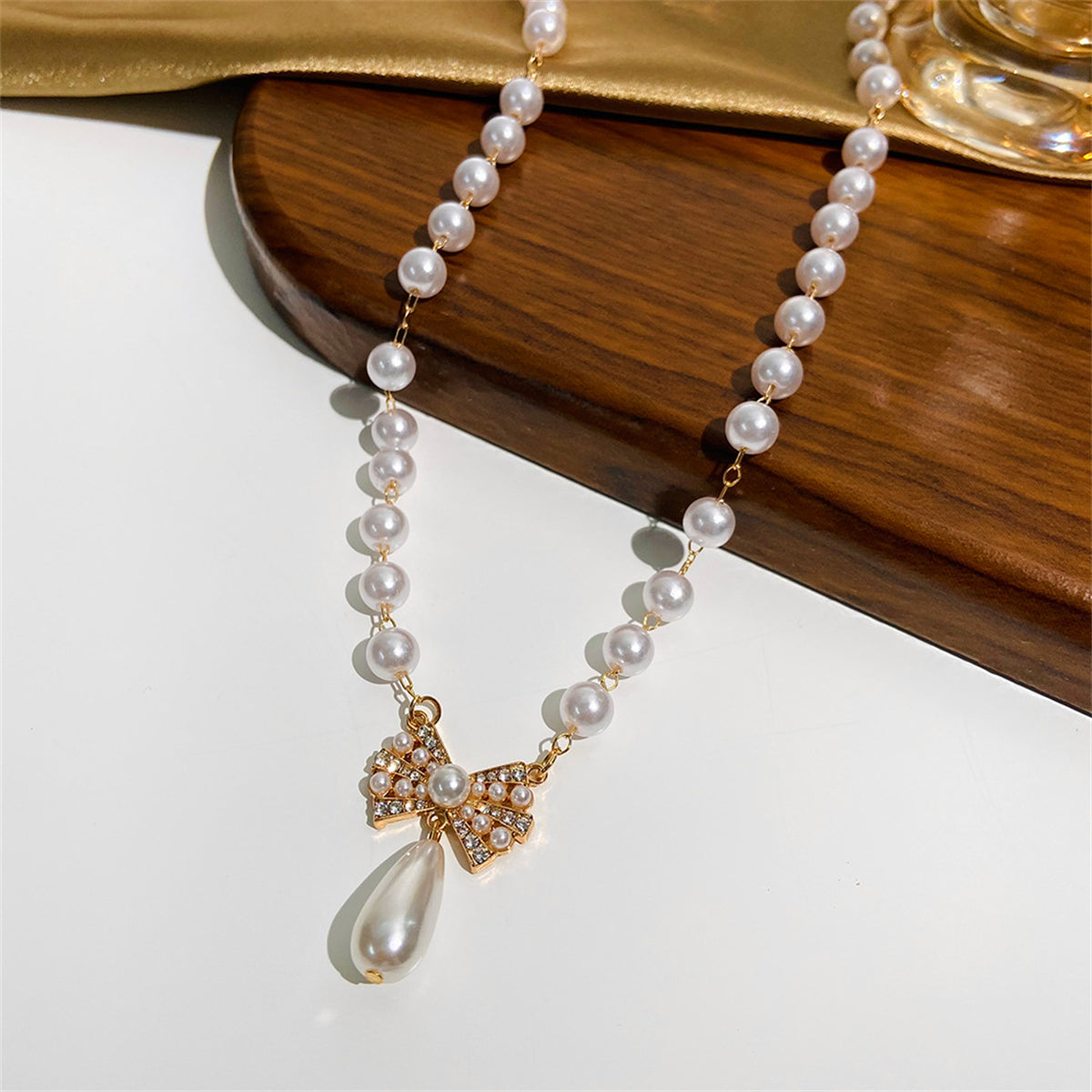 Pearl and Cubic Zirconia 18K Gold-Plated Bow Pendant Necklace, gold pendant necklace for women, detail close-up